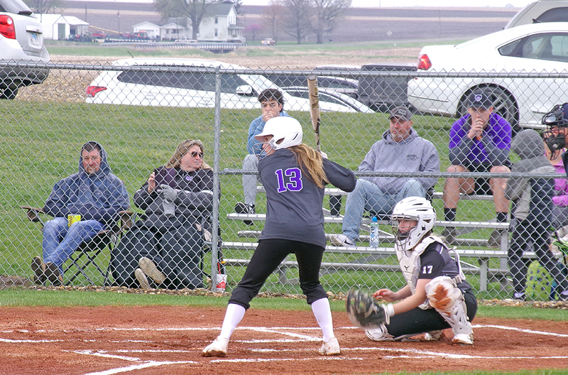 Miley Harper, number 13, is preparing to score one of her two hits with three at-bats.