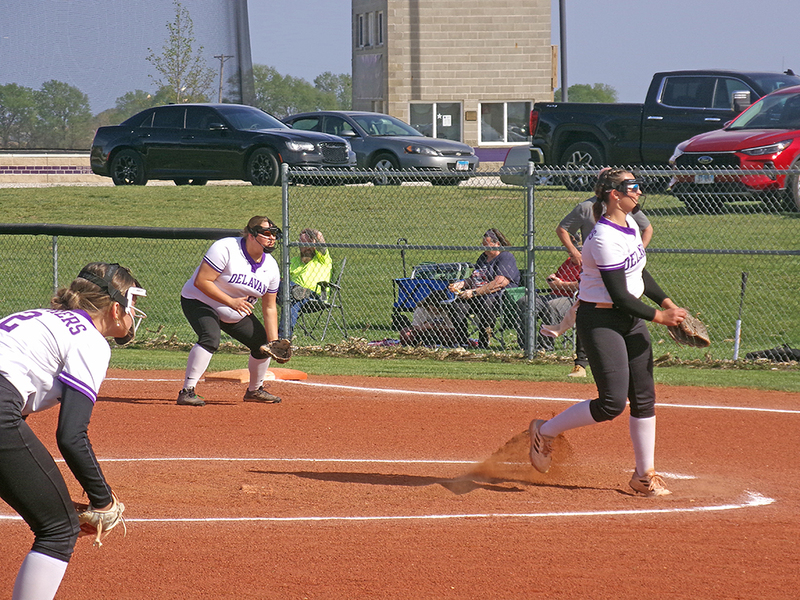 Lainey Klokkenga, number 9, in the circle, Joselyn Soldal, number 24, on first base, and Addi Fisher, number 2, at third base.