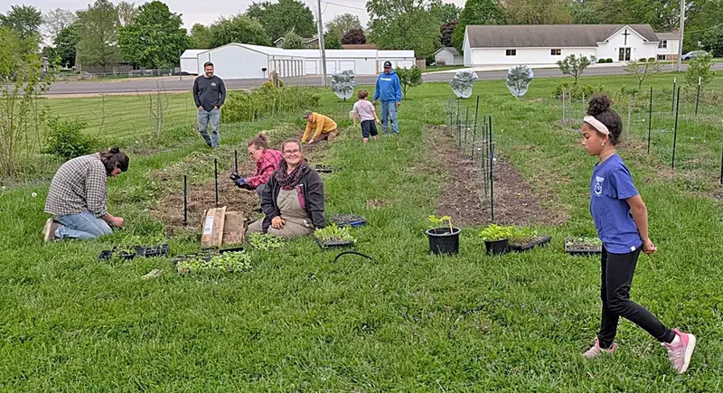 Fin and Fruit volunteers planting at Anticipation Acres.