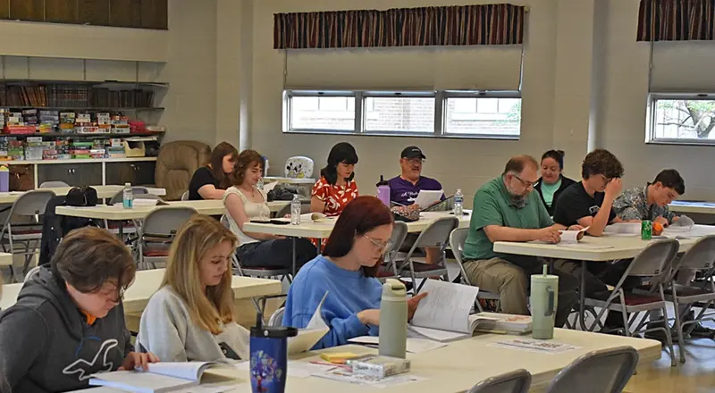 Alison Knapik (center, in red), participating in a table read with fellow cast members.