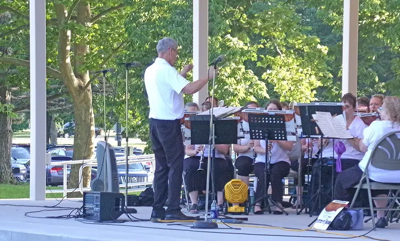 Steve Skinner conducts the Pekin Park Concert Band through a spirited performance of the 'Host of Freedom' march.