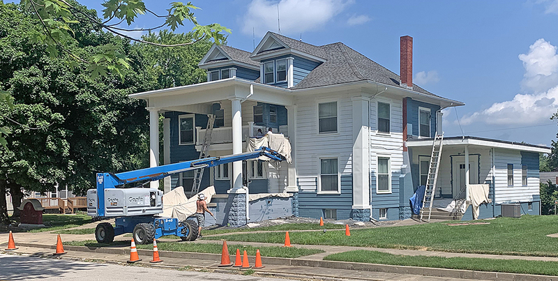 Davis-Oswald Funeral Home on 3rd Street being painted.