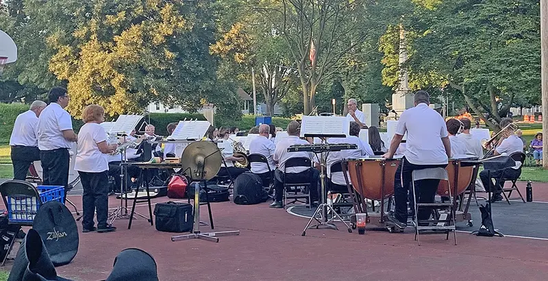 The Pekin Park Concert Band performs its final concert of the 98th season on Tuesday, August 5, in Veterans Park, Delavan—filling the summer air with music, memories, and heartfelt tributes beneath the evening sky.