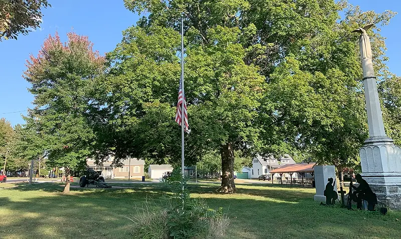 The flag at Veterans Park flies at half-staff on September 14, 2025, as part of a statewide observance honoring victims of political violence. Governor JB Pritzker’s order calls for reflection and unity amid recent national tragedies.