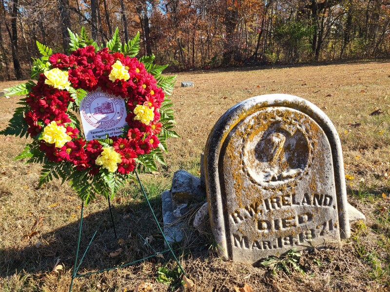 A commemorative wreath placed at the gravesite of Richard W. Ireland in Tennessee Point Cemetery, honoring the youngest Clerk in county history as part of the Bicentennial remembrance series.