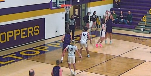 Hudson Briggs rises up for two as Hunter Lusher positions under the rim, ready to secure the rebound.