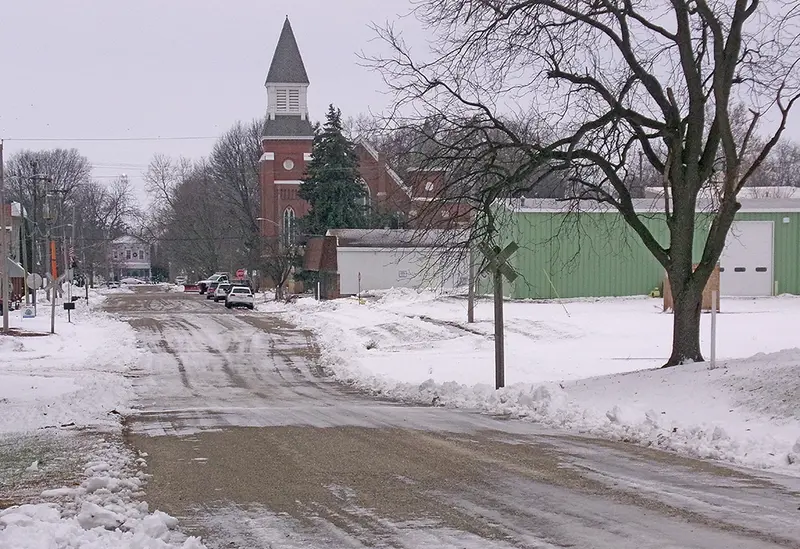 East 5th Street, freshly cleared and facing west, shows the calm after Saturday’s storm.