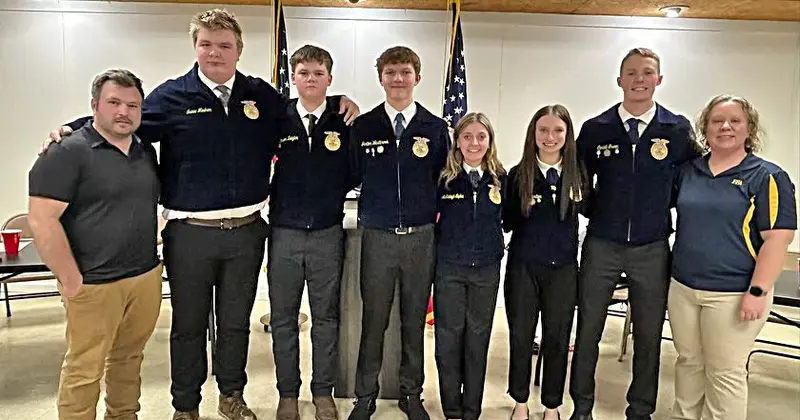 The 2026 Delavan FFA Officers stand proudly with their faculty advisors. From left: Mr. Theo Allen (Faculty Advisor), Isaac Meeker (Reporter), Mason Ziegler (Secretary), Jaxton Westbrook (President), McKinleigh Sipka (Vice President), Lily Carlton (Treasurer), Coriell Green (Sentinel), and Mrs. Nicole Phillips (Faculty Advisor).