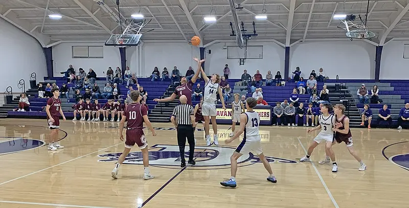 Delavan’s Hudson Briggs (#14) launches skyward at tip-off.