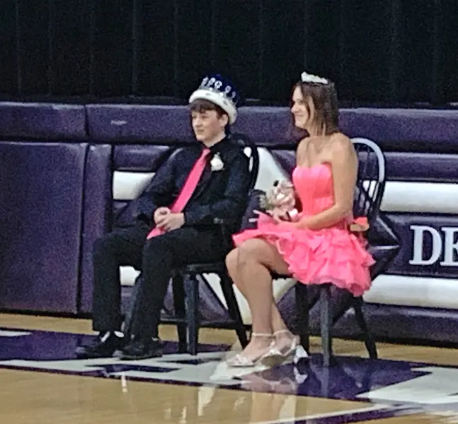 Homecoming royalty Kaelen Morris (left) and Ella Green (right) share a proud moment after being crowned King and Queen at Friday night’s celebration.
