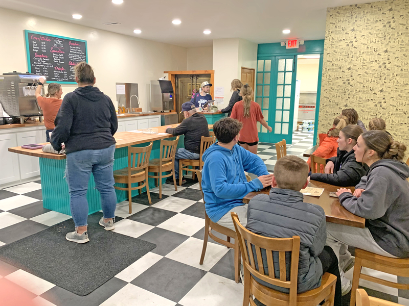 Fans packed into AO’s Ice Cream Parlor after the Panthers basketball game, turning the new downtown spot into a gathering place for players, families, and community supporters.