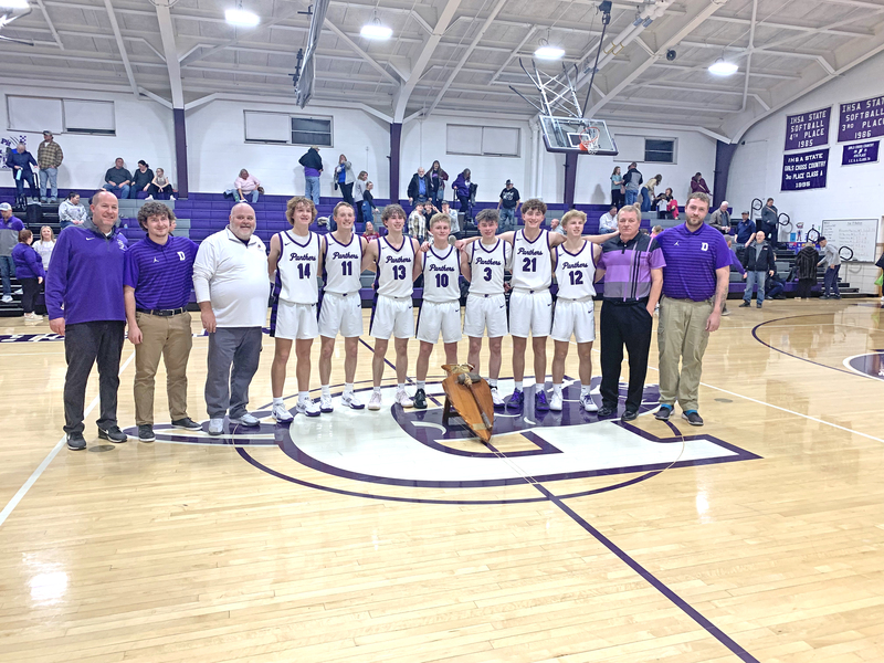 The varsity Panthers celebrate with the traveling Tomahawk Trophy after their win over Midwest Central. Pictured left to right: Jake Green, Josh Lake, Dan Hansen, Hudson Briggs, Corie Green, Corbin Soldal, Grady Burrell, James Pagel, Hunter Lusher, Trace Kight?Garlisch, Rick Urish, and Phillip Jones.