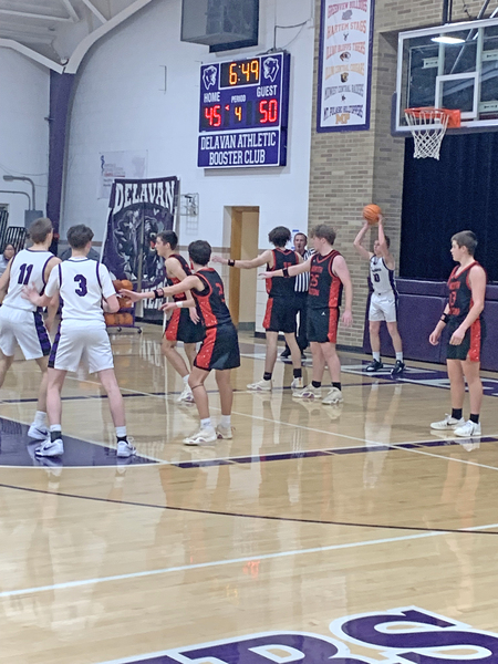 Grady Burrell (#10) looks for an opening as he attempts to inbound the ball against tight Wildcat pressure.
