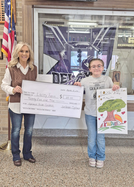 Debbie Woiwode presents award to Lacey Fann.