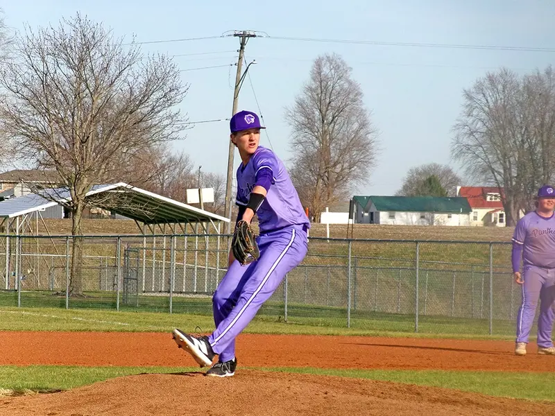Hudson Briggs winds into his delivery, locking in as he fires toward the plate for the Panthers.