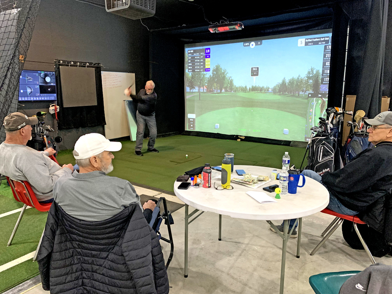 Dennis Moehring settles into his stance and unleashes a smooth drive toward the 4th hole at Ruffled Feathers Golf Club, the simulator capturing every detail of the swing.