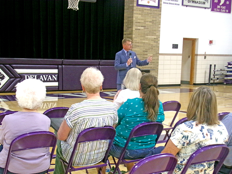 John Ackerman addresses the crowd at Delavan High School, opening the program with a presentation on Delavan Township’s rich history.