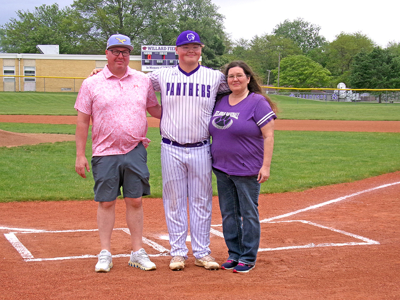 Surrounded by his parents, Sean McMullen and Melinda Bowles, Delavan’s lone senior Cameron McMullen is honored before first pitch against Olympia. A special moment for the Panthers’ veteran leader as he closes out his final season.