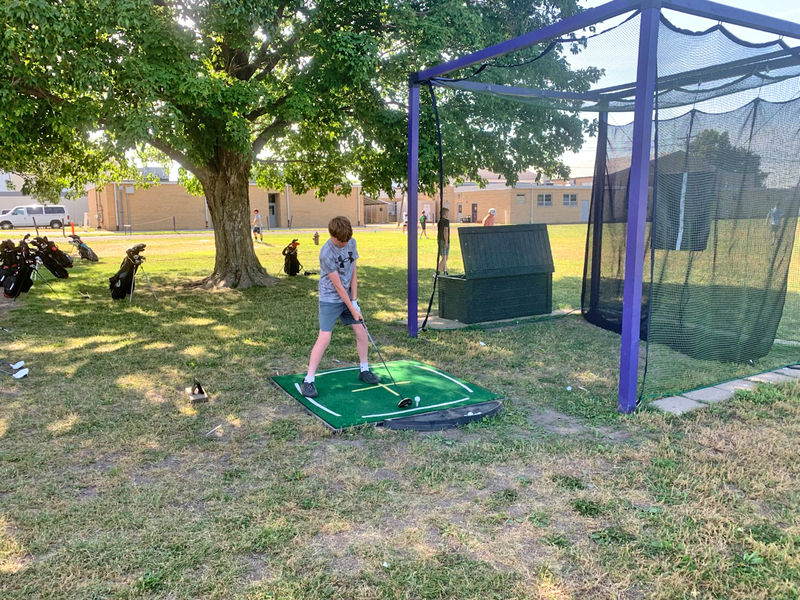 Eli Boswell (7th grade) unleashes a smooth, powerful drive during camp drills, sending his shot an impressive 175 yards.