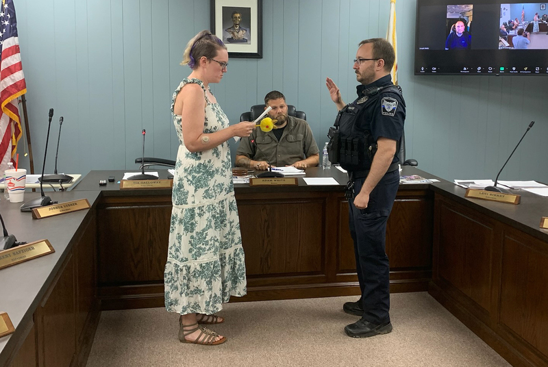 City Clerk Tia Galloway administers the oath of office to Interim Police Chief Carl Dodd during Tuesday’s Delavan City Council meeting, following the resignation of Police Chief Mike Evans. Dodd will lead the Delavan Police Department on an interim basis as the city begins its search for a permanent chief.