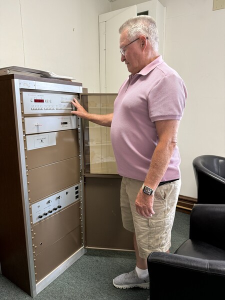 Roger Wright (left) electronically orchestrates the bell ringing at Delavan Presbyterian Church.