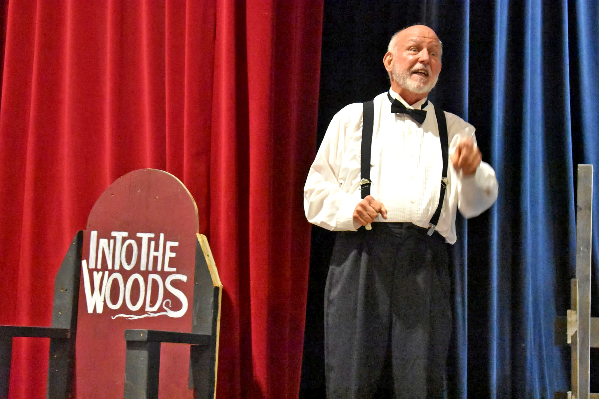 Tim Searby delivers a captivating performance as the Narrator during Lincoln Community Theatre’s production of Into the Woods, guiding audiences through the intertwining fairy-tale adventures on stage.