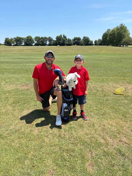 Golf is better when shared with family. Kaeden Mammen (right) and his dad, Dan Mammen (left), on the course during the tournament where Kaeden battled his way to a second-place finish.