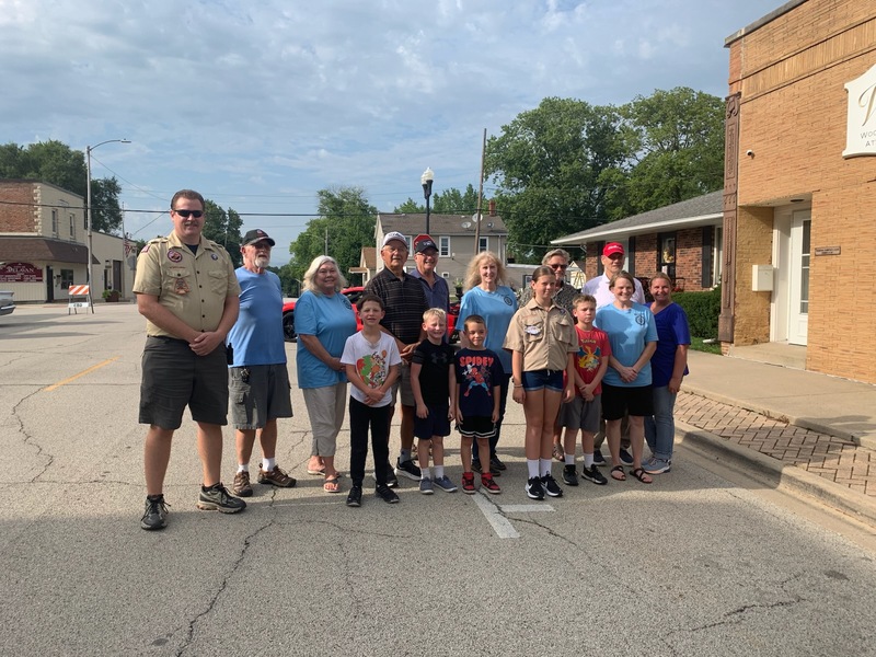 Members of Delavan Cub Scout Pack 3061 and the Optimist Club gather during August’s Cruise-In.