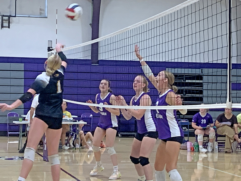 Izzy Brothwood, Gwen Tierney and Kara Lowry close in at the net, stacking pressure on ROWVA/Williamsfield during Thursday’s matchup.